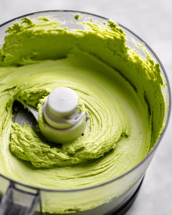 How Do You Make Homemade Pistachio Butter 3 Food processor transforming roasted pistachios into smooth creamy pistachio butter
