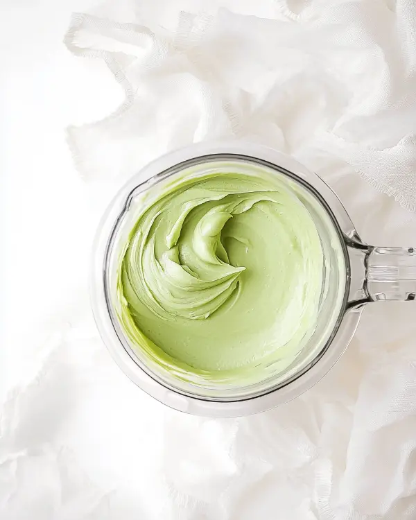 Iced green tea latte with whipped cream