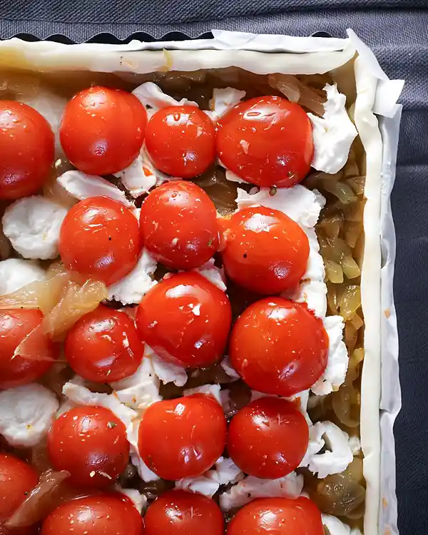 goat cheese tart with caramelised onions and tomatoes